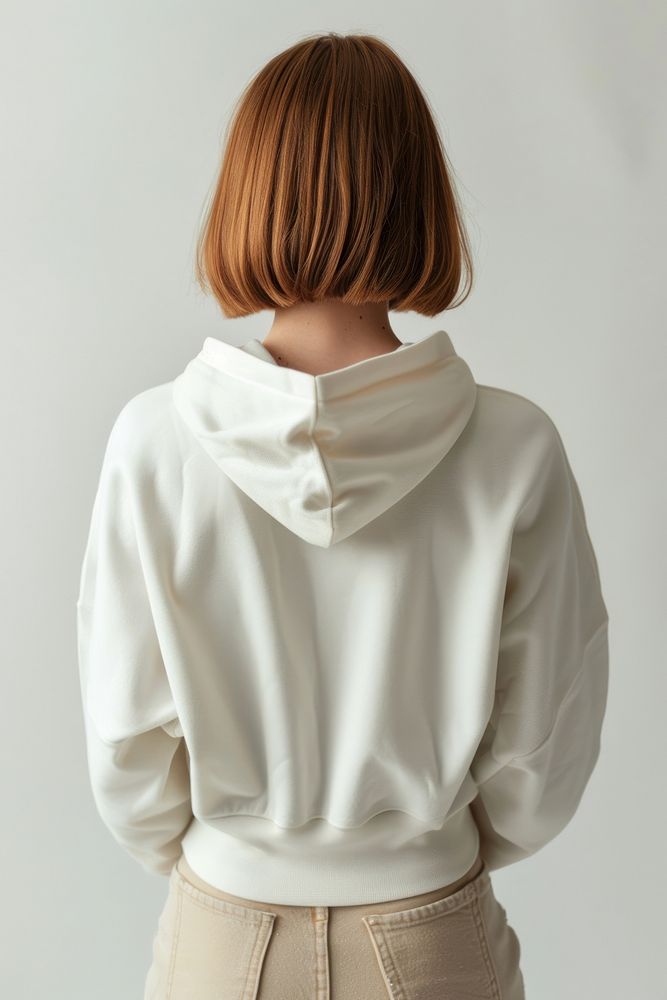 Young woman wears blank white hoodie mockup hair clothing knitwear.