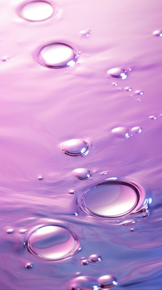 A purple background with water ripples appliance droplet device.