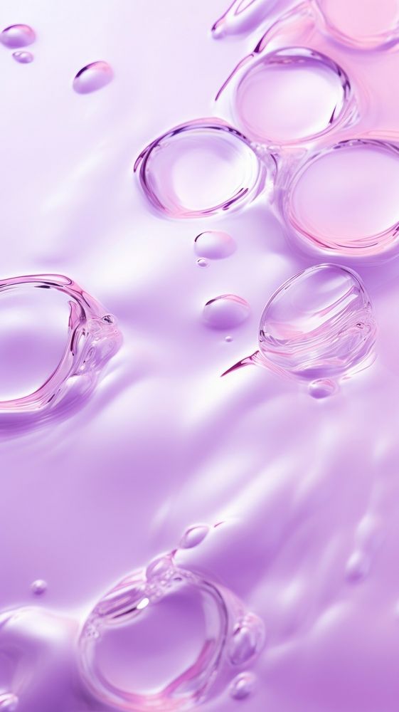 A purple background with water ripples droplet blossom flower.