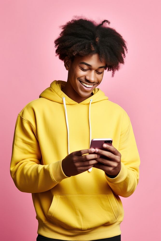 A teenage black man waring pink sweater knit happy smile photo.