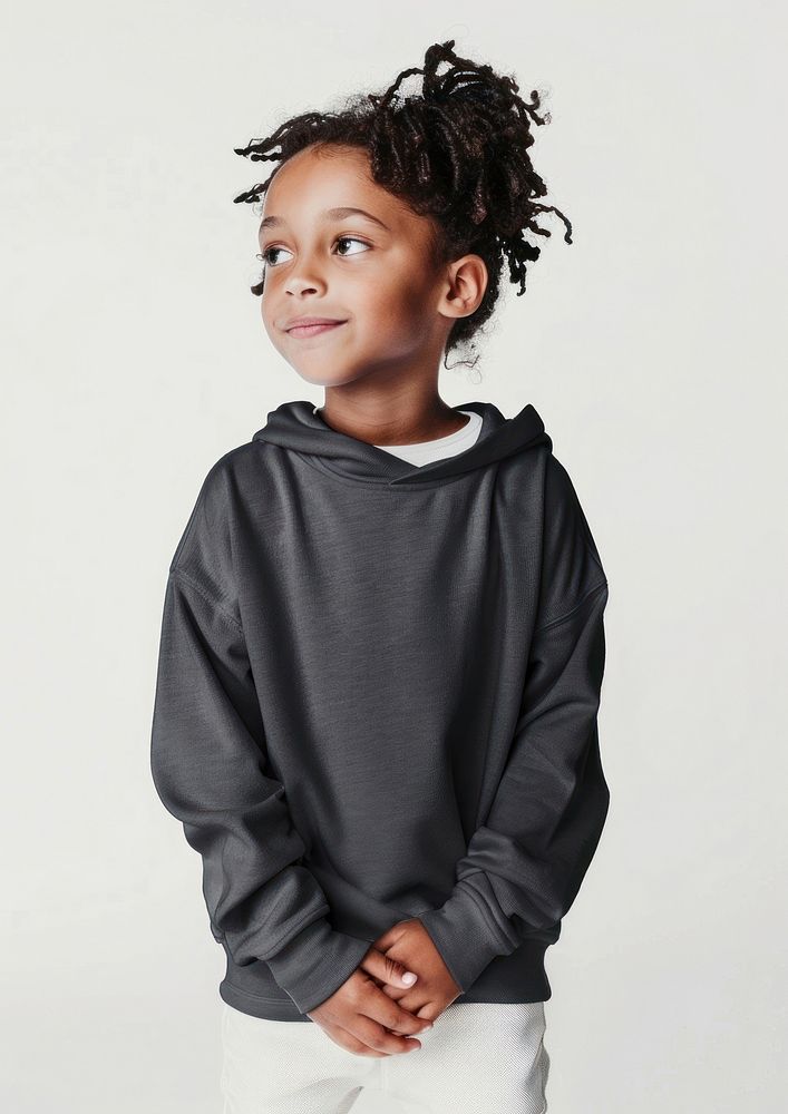 Smiling child wearing black hoodie