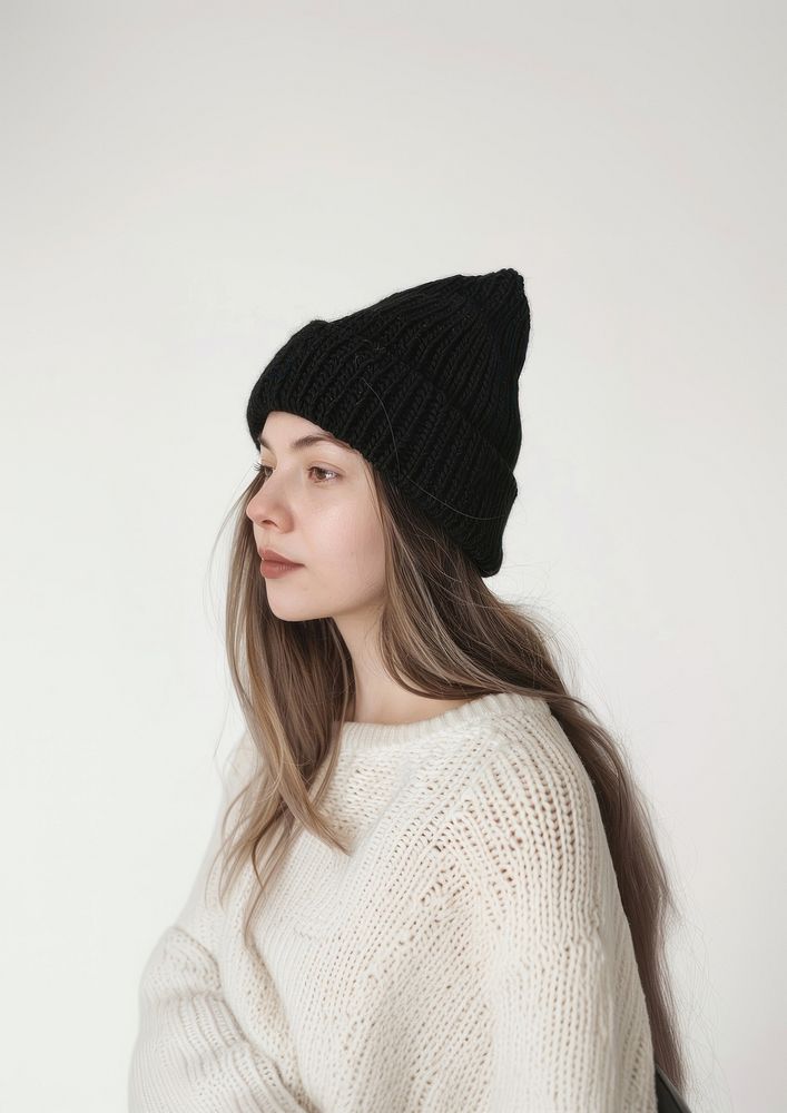 Woman wearing black knit beanie