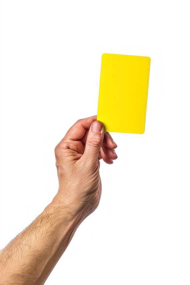 Hand holding yellow card