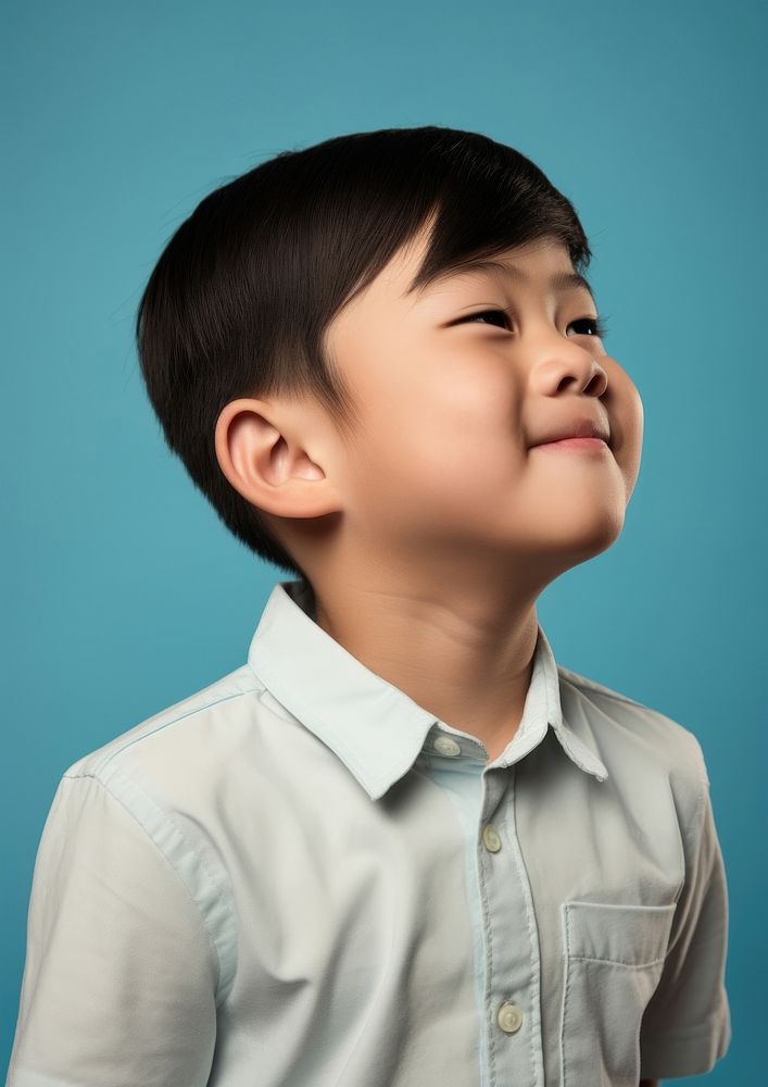 Smiling child portrait blue background