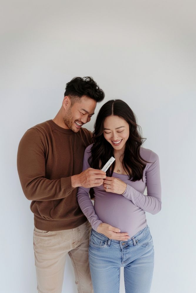 Happy couple expecting pregnancy announcement