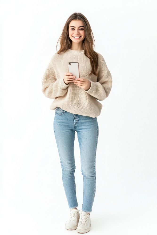 Woman holding mobile phone background sweater smiling.