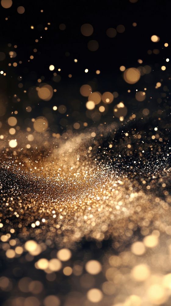 Shimmering golden particles background celebration glittering.