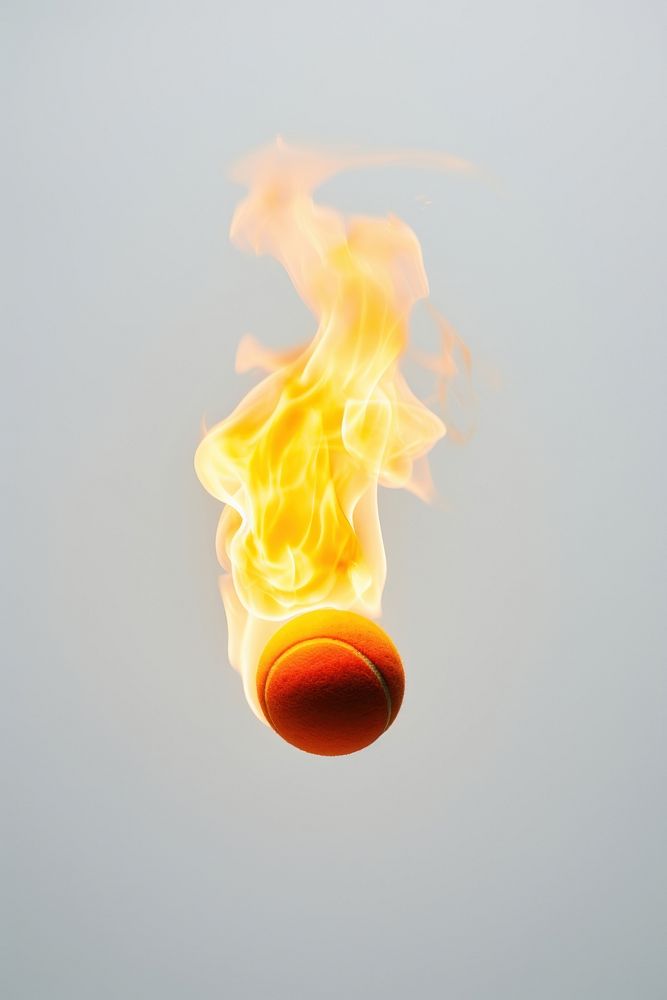 Tennis ball fire burning flame.