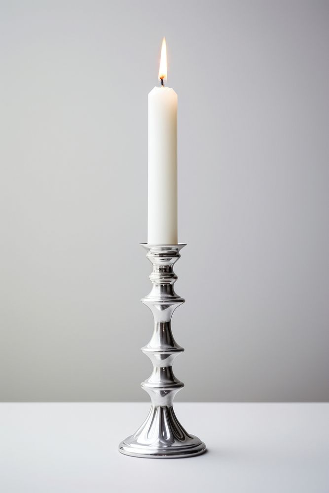 Taper candle holder celebration candlestick lighting. AI generated Image by rawpixel.