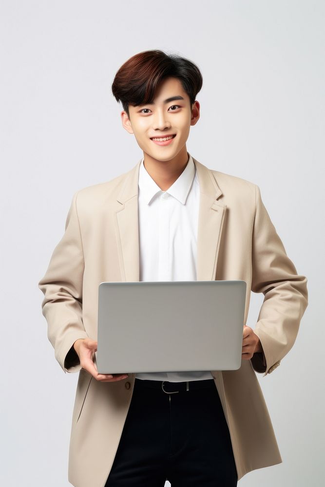 Happy smiling asian teenager student holding laptop using computer technology presenting elearning portrait adult photo. AI…