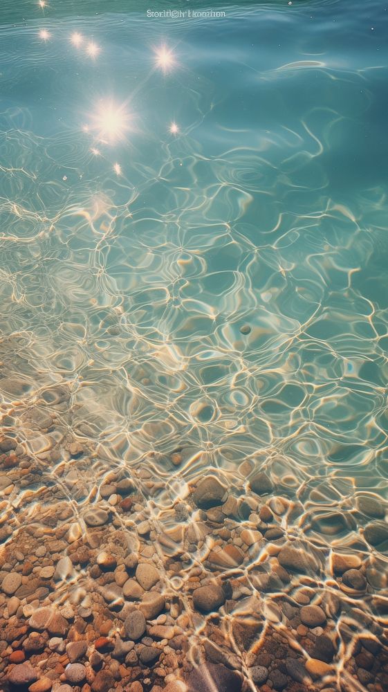  Gravel under the clear water underwater outdoors nature. AI generated Image by rawpixel.