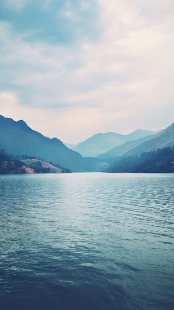 Lake with mountain view landscape outdoors horizon. AI generated Image by rawpixel.