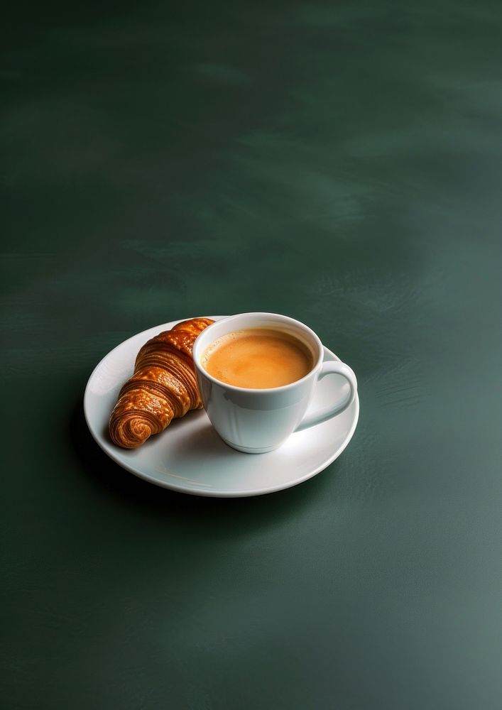 Coffee cup croissant breakfast drink.