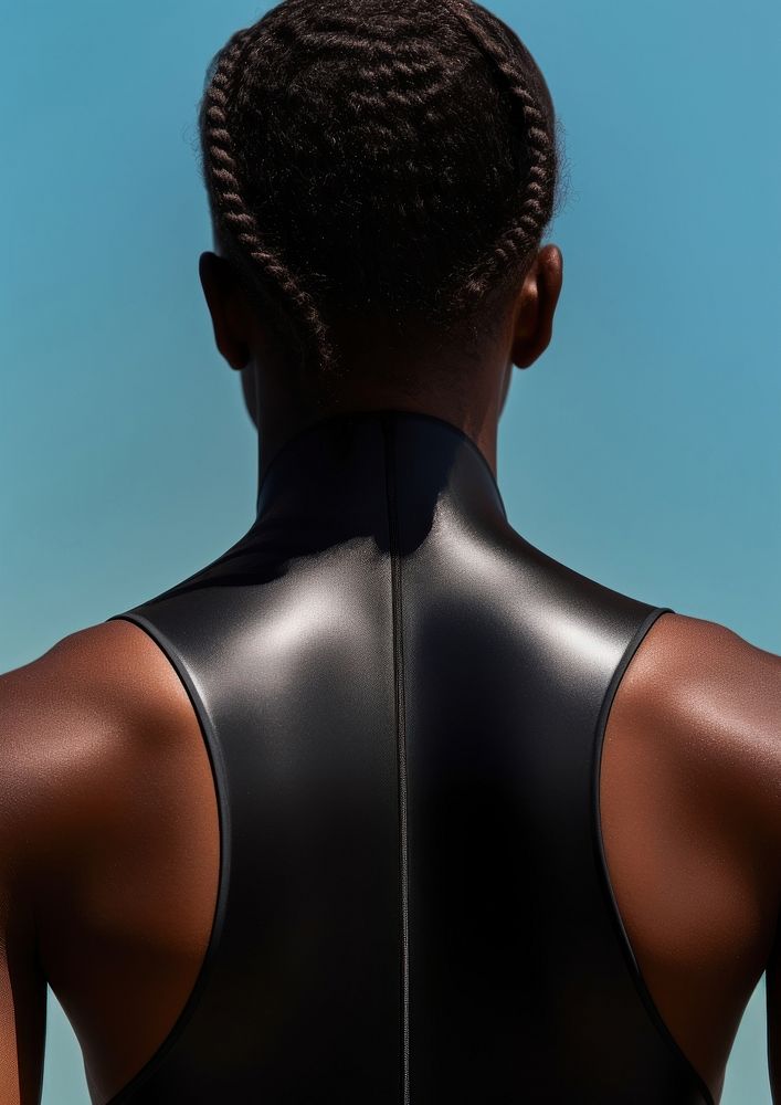 The back of a black person wearing a swimming costume hairstyle portrait headshot.