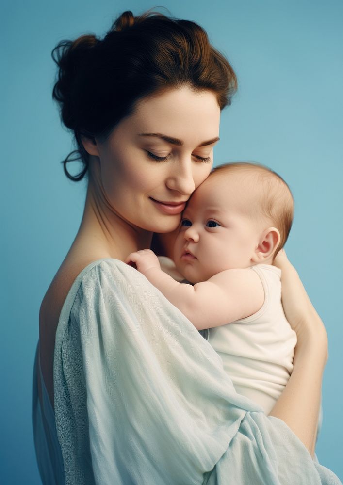 Mommy holding her baby up portrait newborn photo.