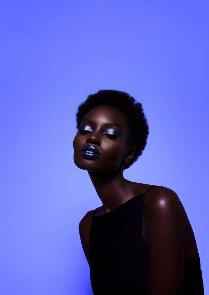 A black teenage woman with navy makeup photography portrait fashion.