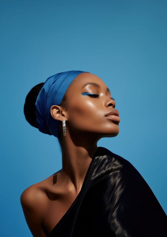 A black woman wearing blue eyeliner photography portrait fashion.