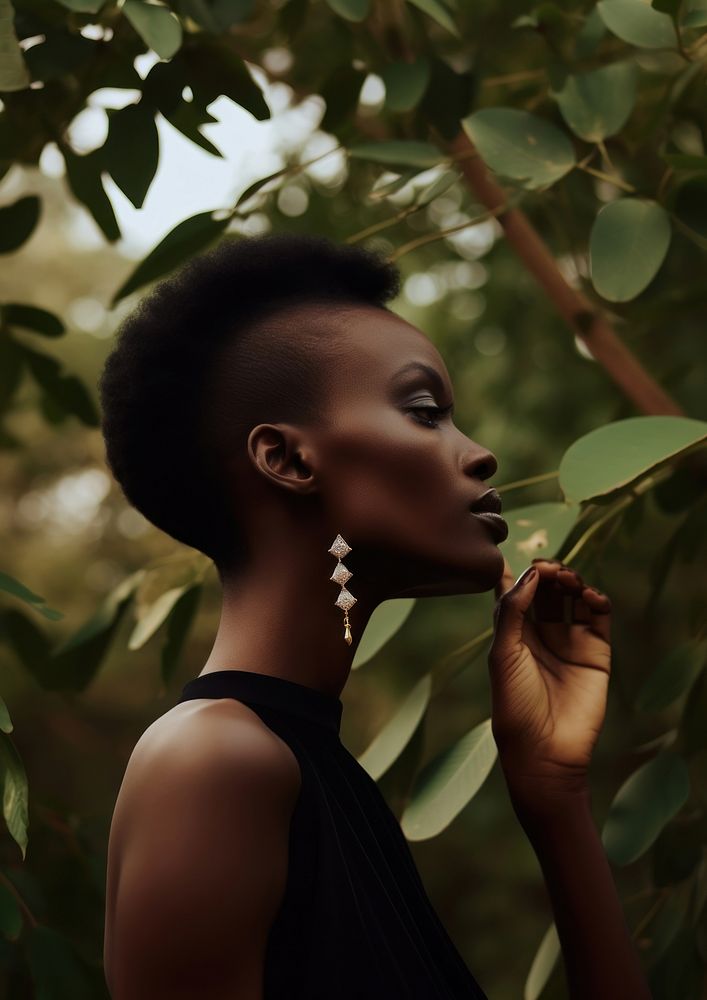 A black woman wearing modern diamond earring and ring fashion forest adult.