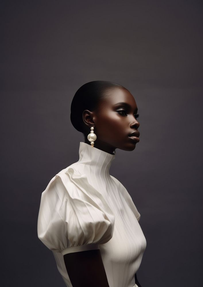 A black woman wearing pearl earring photography portrait fashion.