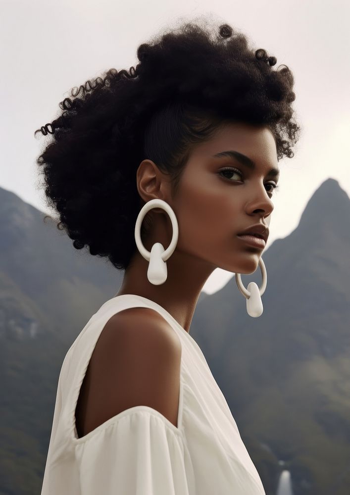 A black woman wearing white earring photography portrait jewelry.