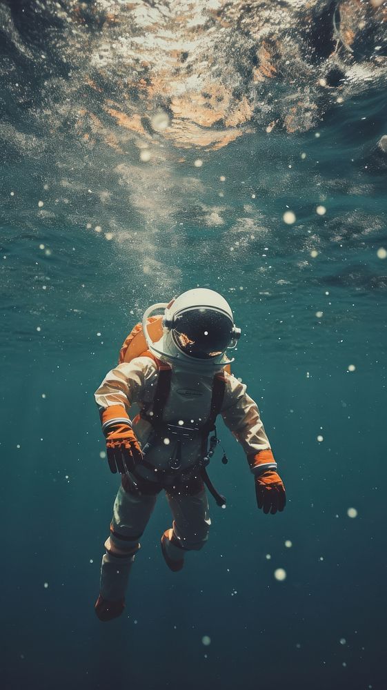An astronaut under sea underwater adventure swimming.