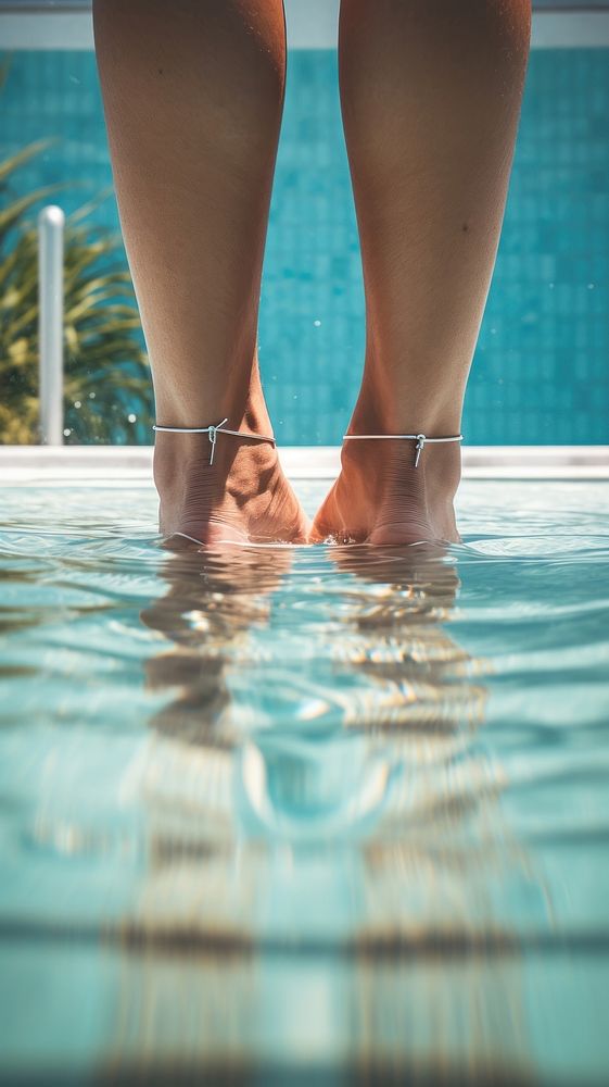  Couple legs in swimming pool adult reflection relaxation. AI generated Image by rawpixel.