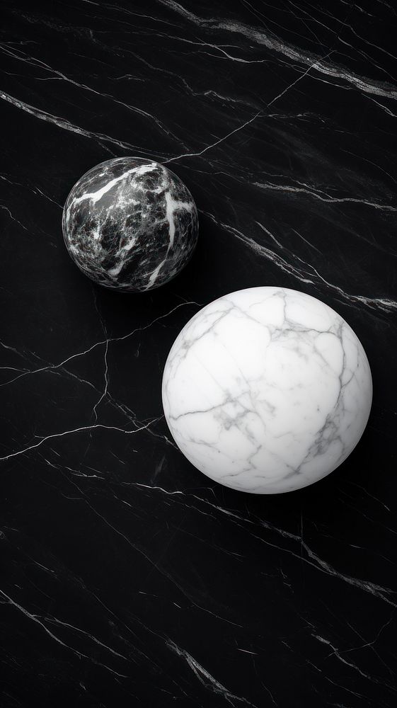 Photography of marble sphere black white.