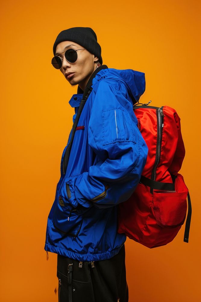 Asia man jacket backpack glasses. AI generated Image by rawpixel.