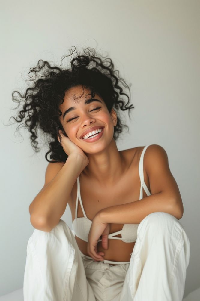 A model latina Caribbean girl laughing portrait smiling.