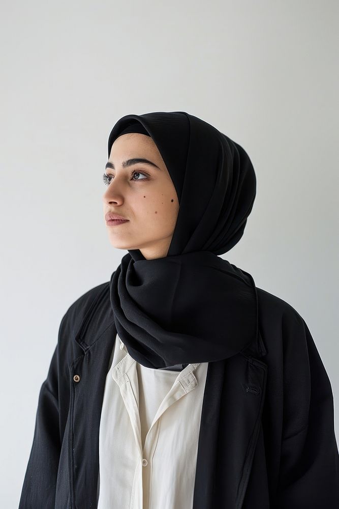 A Muslim woman looks ahead with determination portrait scarf photo.