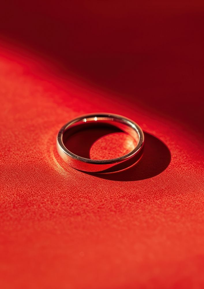 Ring jewelry red red background.