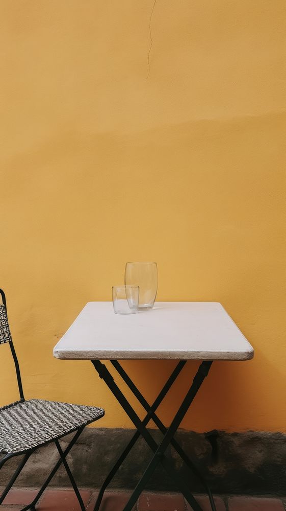Outdoor table furniture outdoors yellow. AI generated Image by rawpixel.