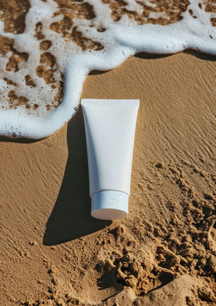 Sunscreen tube  beach cosmetics outdoors.