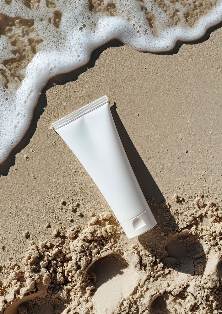 Sunscreen tube  beach cosmetics sunlight.