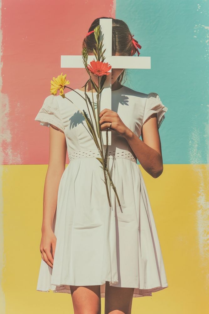 A girl in a white dress holding a Christ cross flower plant creativity.