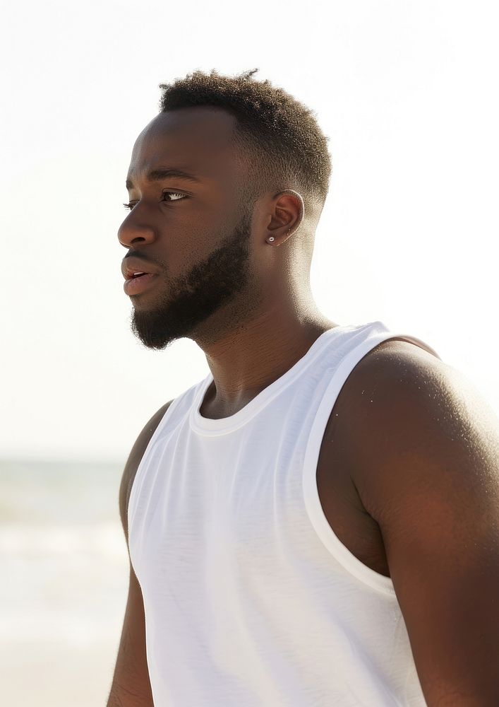 Black man wearing white tank top adult contemplation tranquility.