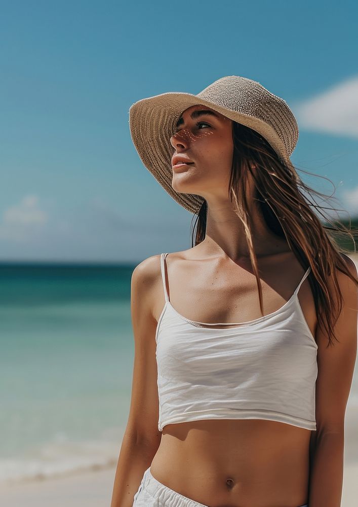 Woman wearing white tank top swimwear summer beach.