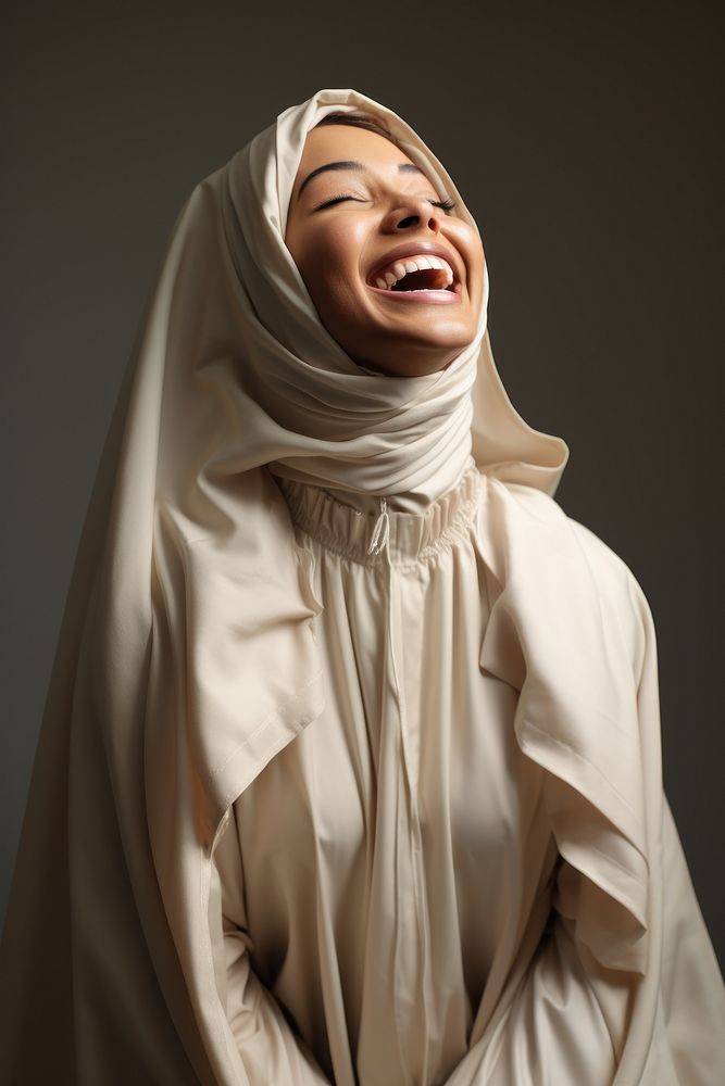 A joyful Cubby Muslim woman happiness portrait laughing.