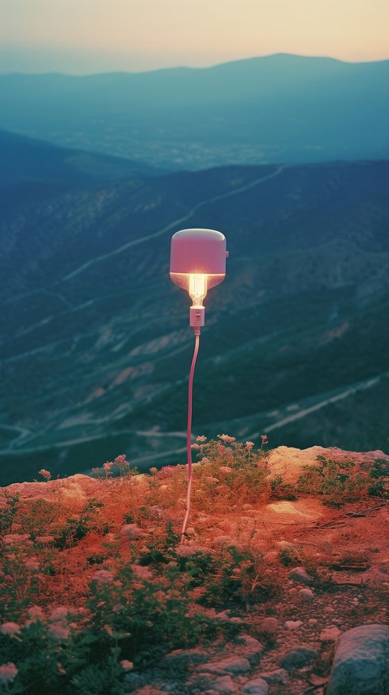 Photography of minimal a cute lamp with hillside landscape outdoors lighting nature.