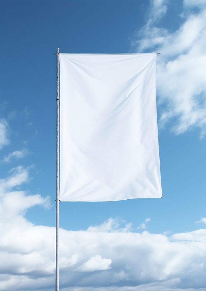Close up white blank banner flag blue sky.