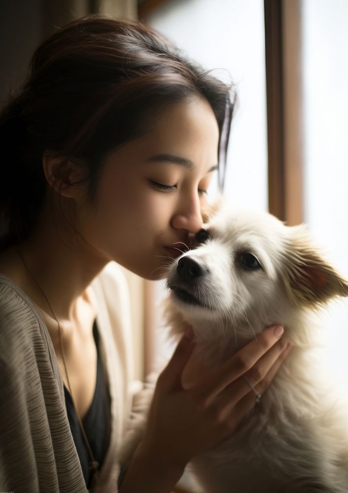 Japanese man pet portrait kissing.