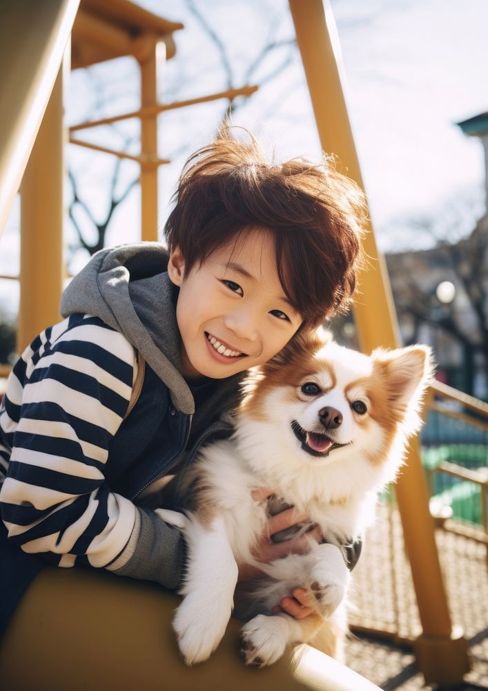 Japanese boy dog playground portrait.