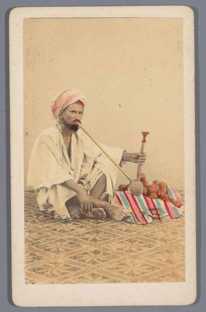 Portret van een onbekende Egyptische man met waterpijp en sinaasappels (1863 - 1869) by Wilhelm Hammerschmidt