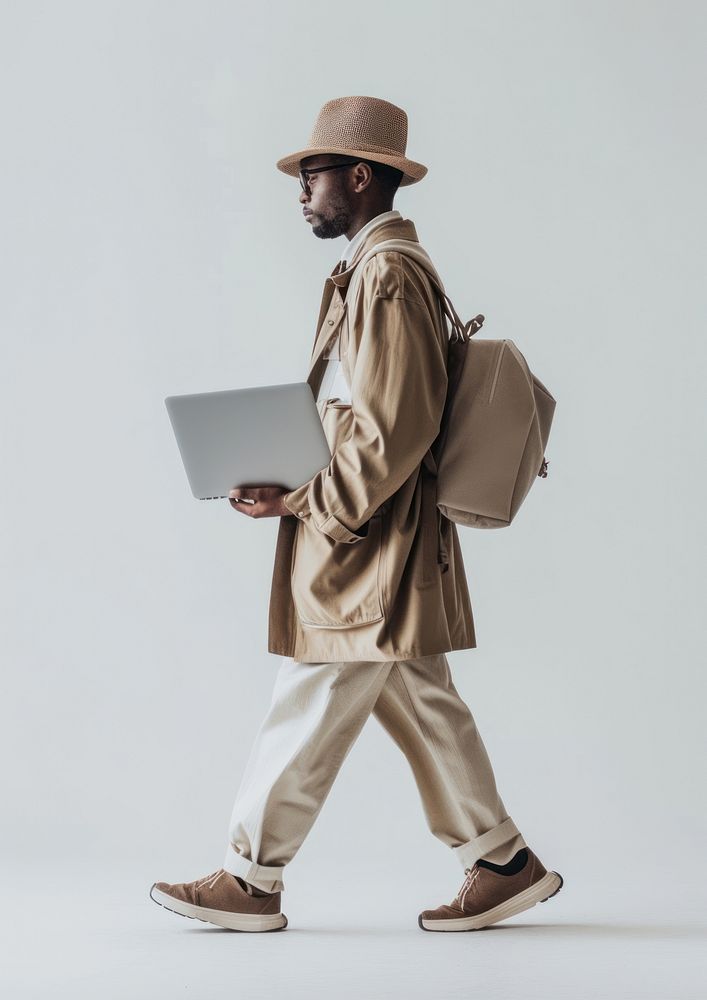 Person holding laptop walking photography computer.