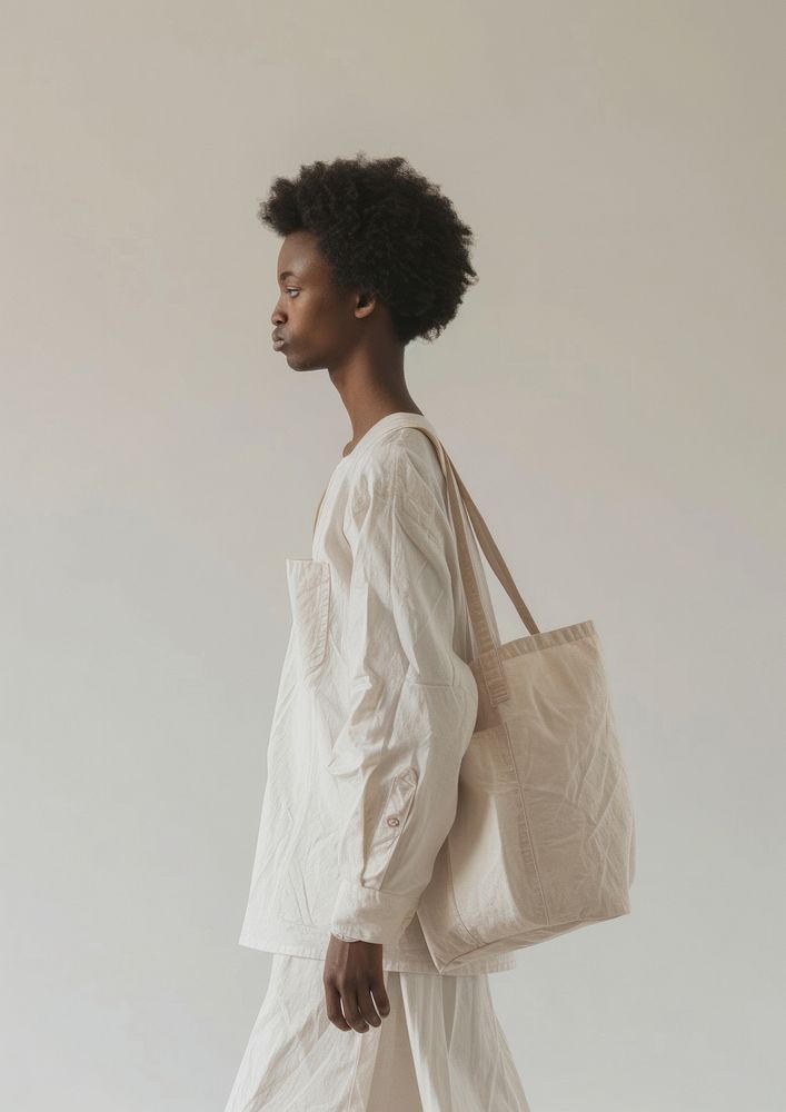 Person holding tote bag handbag person studio shot.