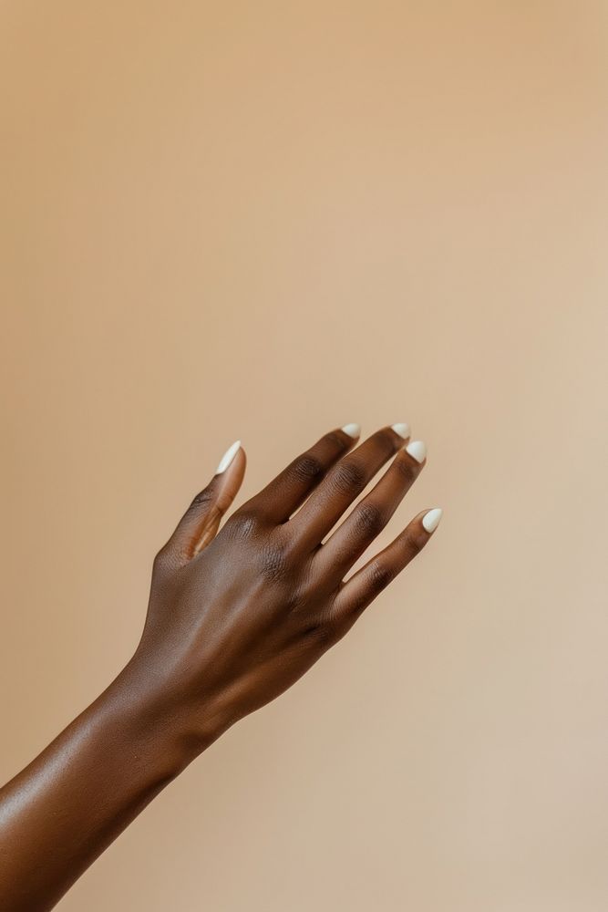 Neutral beige manicure nails hand finger fingernail.