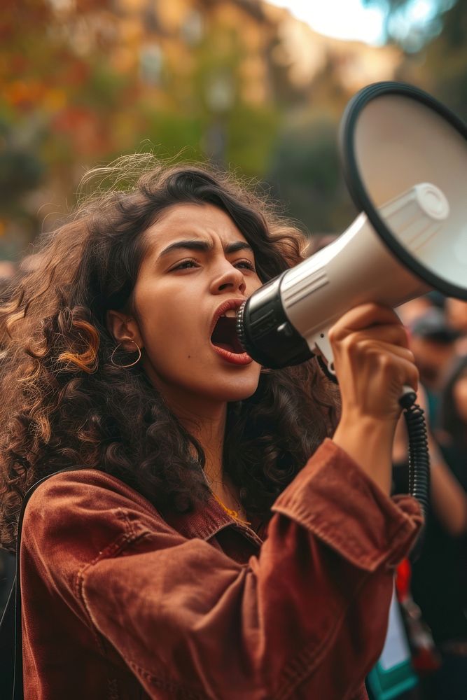 Woman speaking through a megaphone shouting adult performance. AI generated Image by rawpixel.