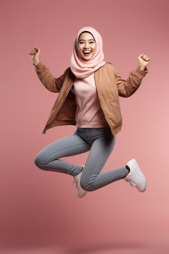 Full-length elastic jumping laughing smiling adult.