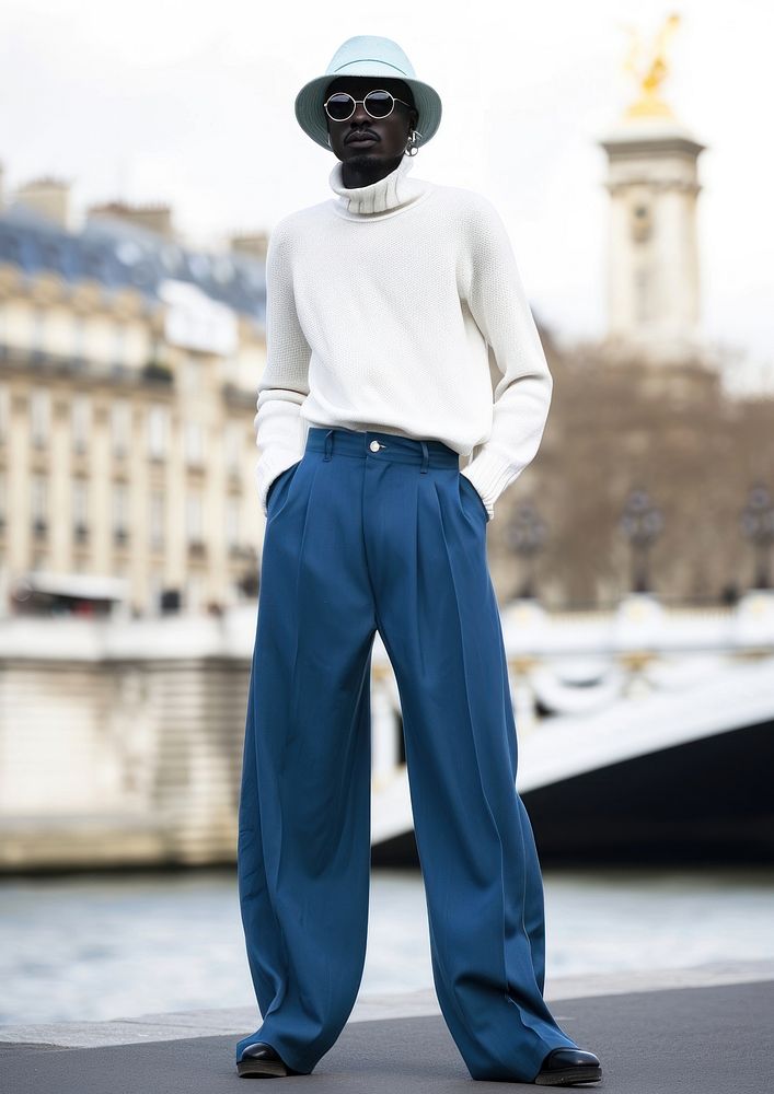 Man a beanie hat trousers standing fashion. AI generated Image by rawpixel.