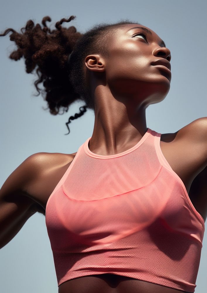 Black female athlete is running adult pink determination.